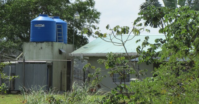 Roof top tanks store water in a Panamanian village without continuous water supply.