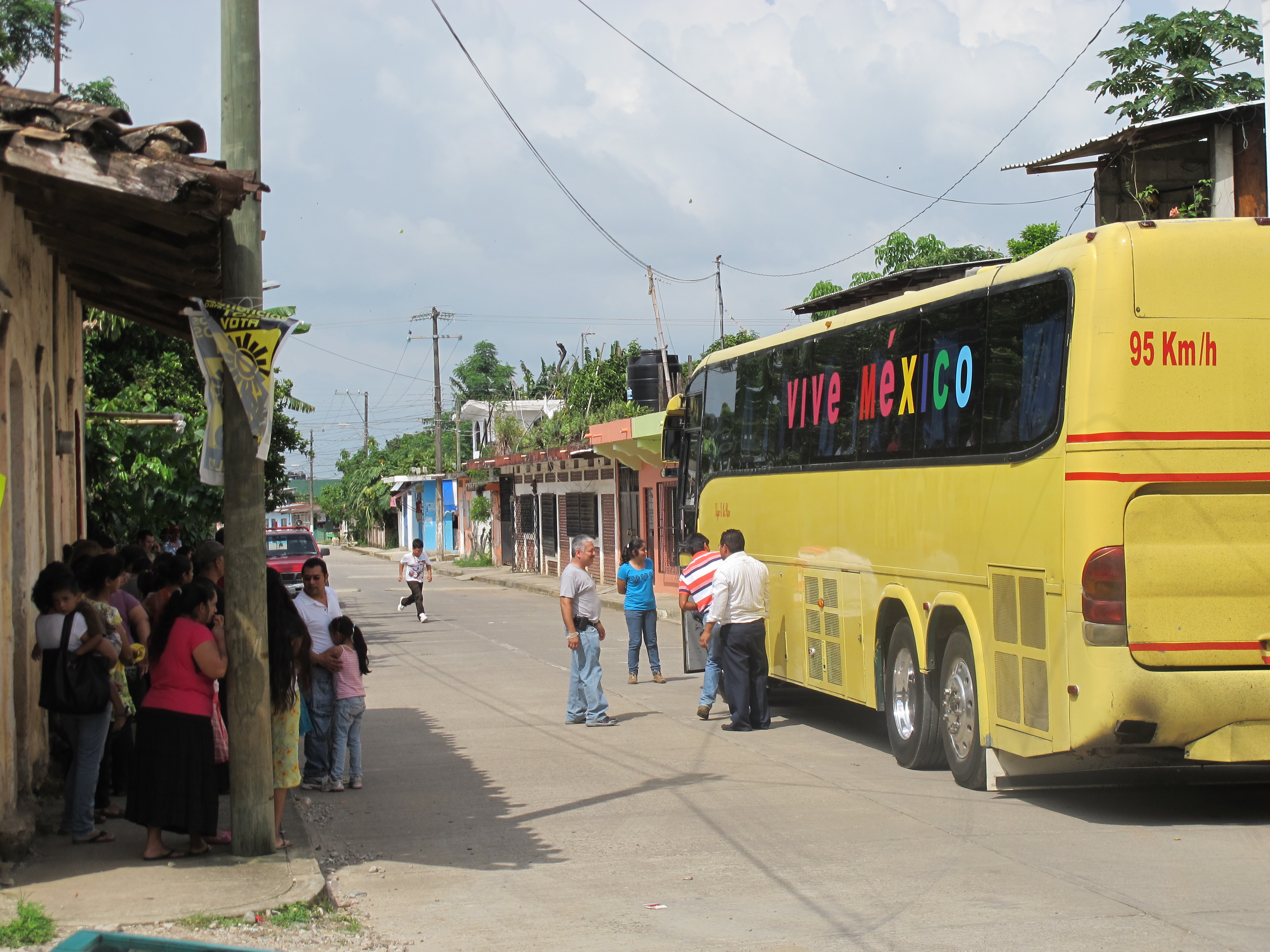 A group of men boards a bus bound for the U.S. in the town of Tlapacoyan, Mexico.