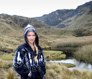 Image of Emma Steigerwald surrounded by mountains and a river