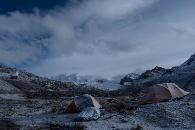 A photo of a camp on top of a mountain with cloudy skies in Cordilera