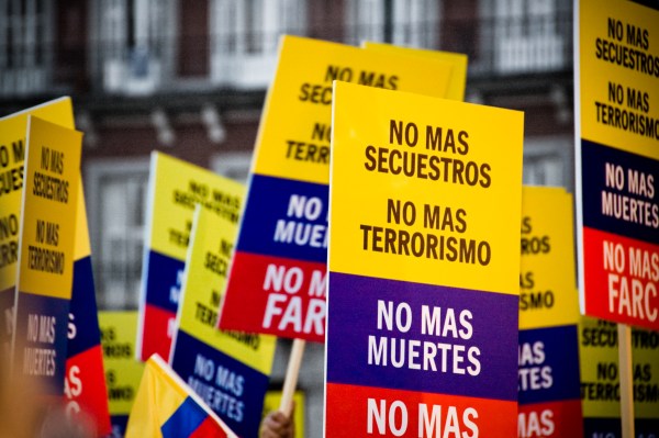 A demonstration against FARC, 2008, with signs reading "No more kidnapping, no more terrorism, no more deaths."
