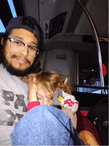 The photograph depicts the author and his son riding the bus after Nahuatl class