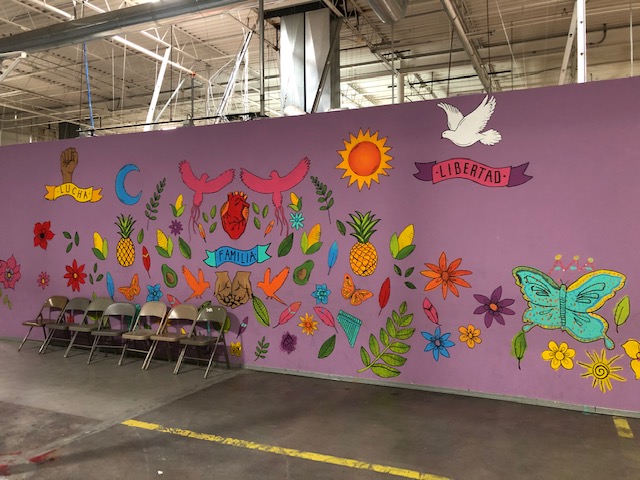 A mural painted in vibrant colors at a shelter for migrants in El Paso, Texas. 