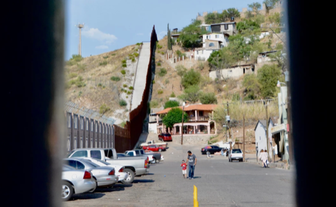 A photo taken through the Nogales wall, showing the town separated by the border.