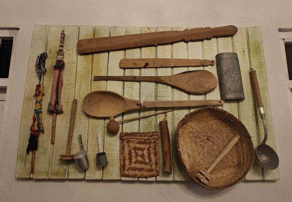 Cooking implements hang on a wall in Colombia.