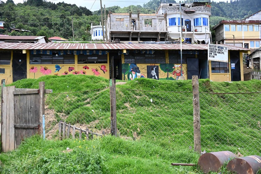 A colorful mural on the wall of a school in Guatemala.
